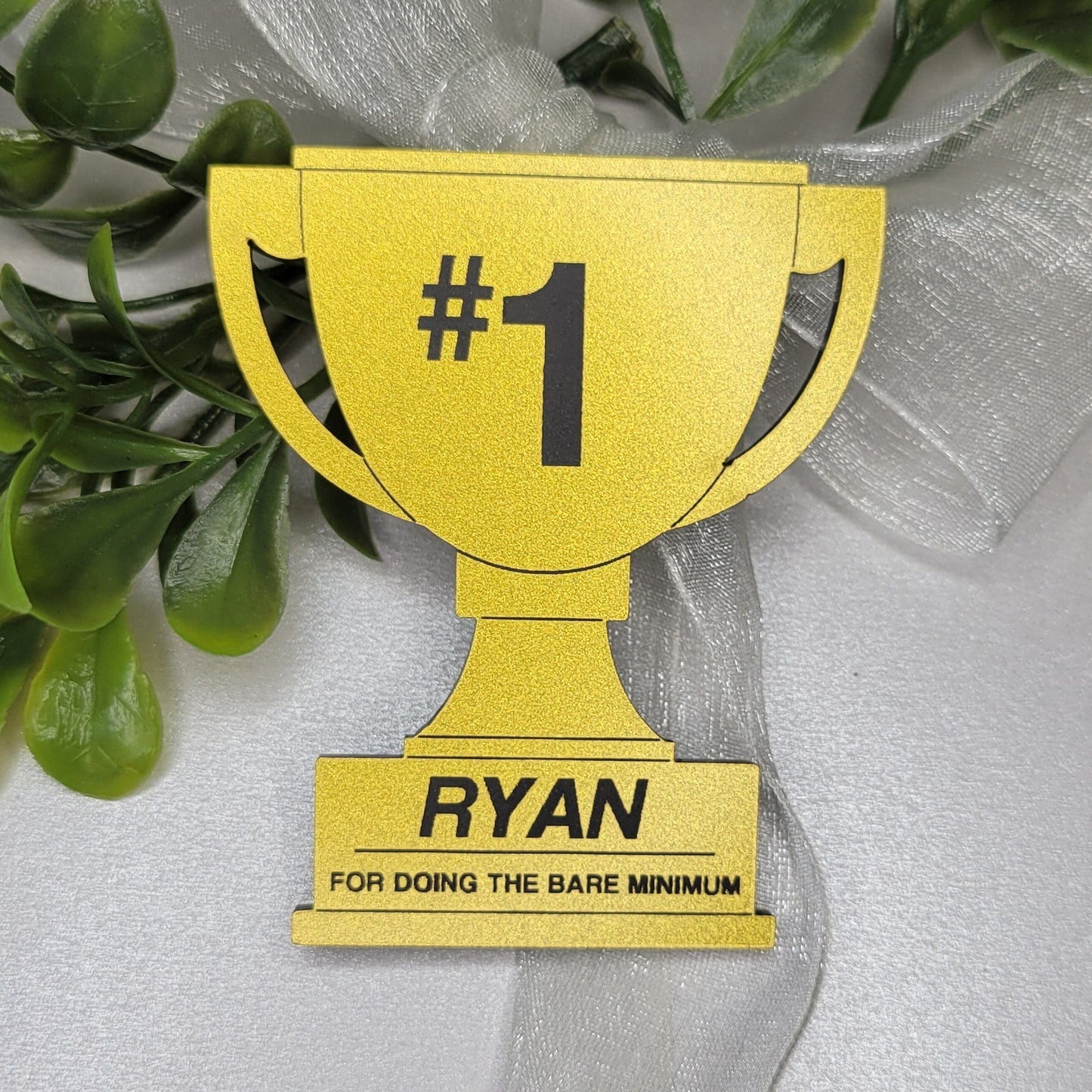 Gold trophy with #1 and name