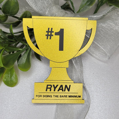 Gold trophy with #1 and name