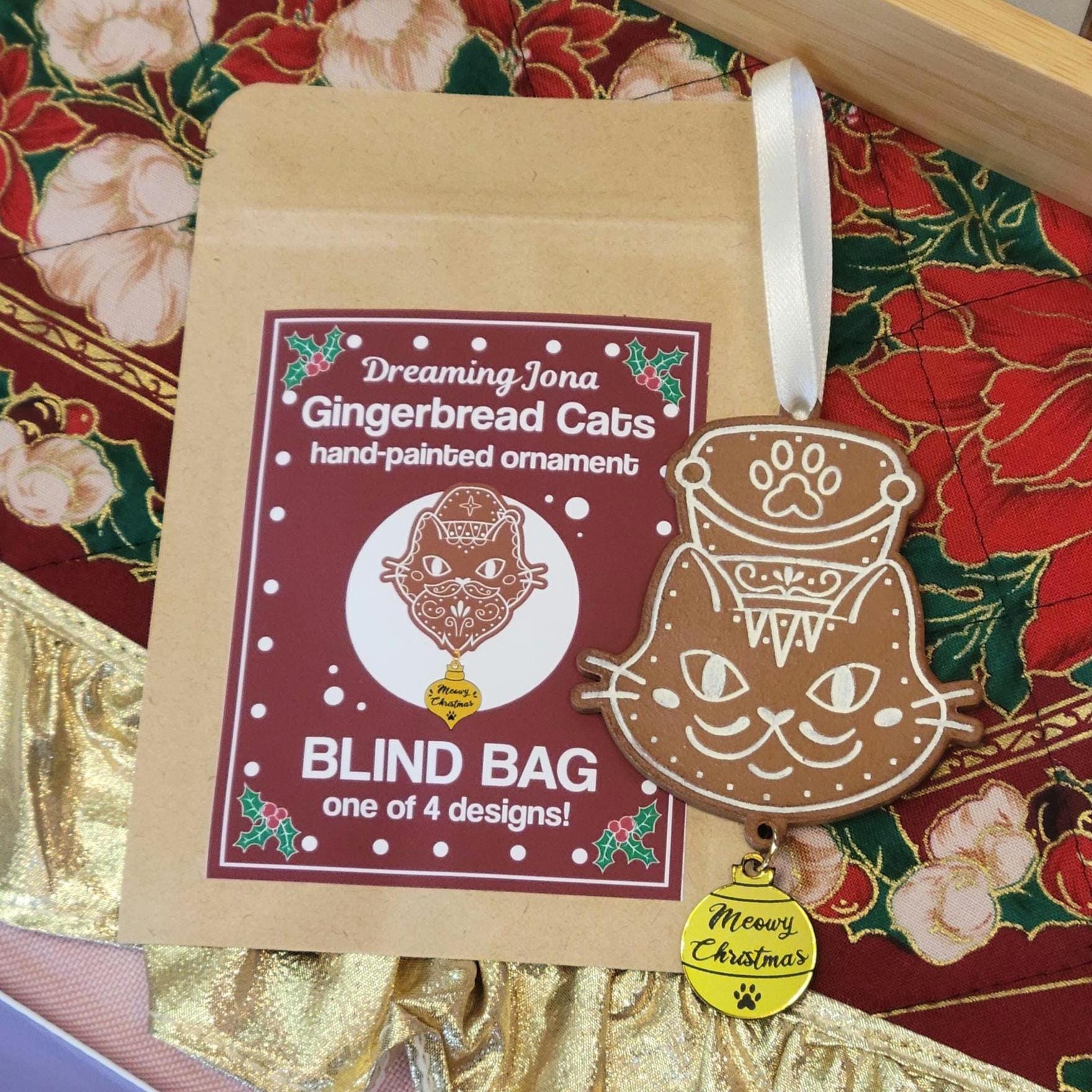 Gingerbread cat ornament with packaging on a festive background