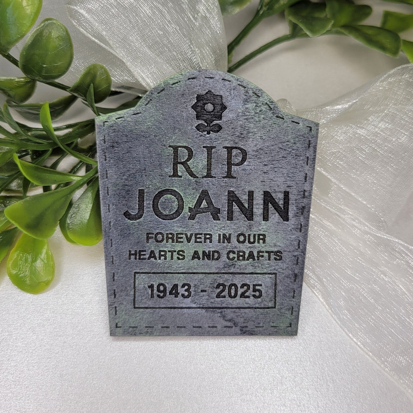 Memorial tombstone with 'RIP Joann' 