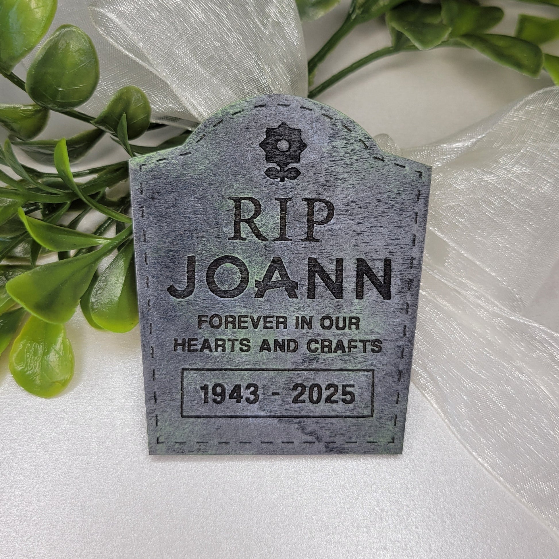 Memorial tombstone with 'RIP Joann' 