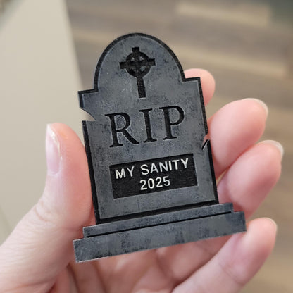 Small tombstone with 'RIP MY SANITY 2025
