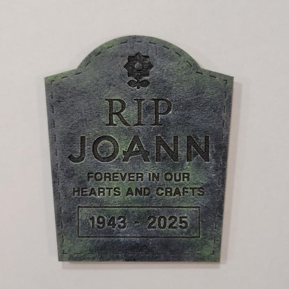 Memorial plaque for 'RIP Joann' with a birth and death year on a white background