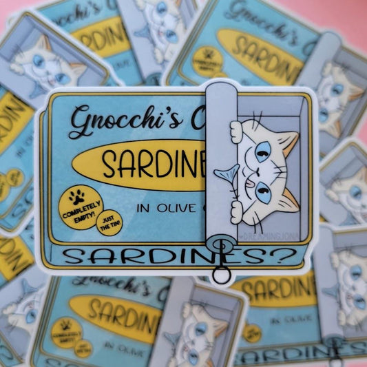 Sticker with cartoon cat design on 'Gnocchi's Sardines?' packaging