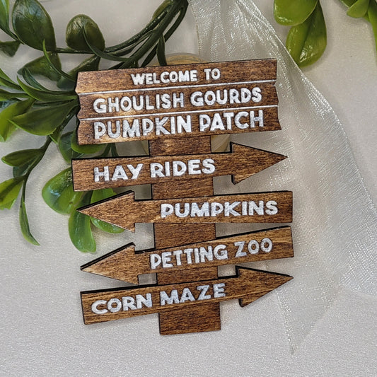 Wooden signs with Halloween-themed text on a white background