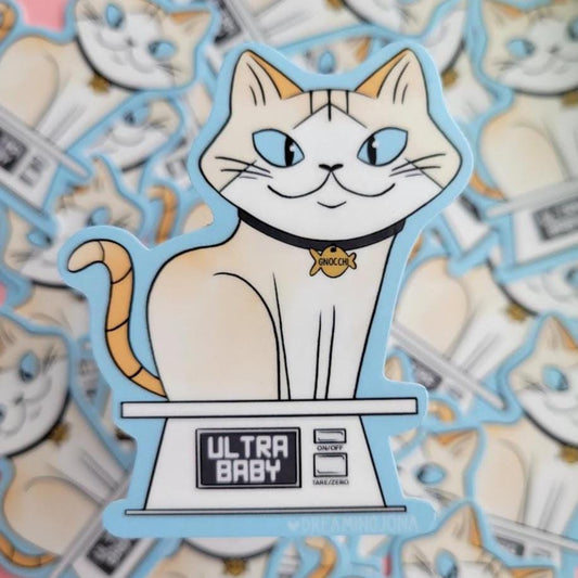 Sticker of a cat on a scale with 'Ultra Baby' branding, surrounded by similar stickers.