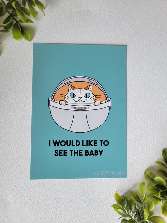 Cartoon cat in a space suit on a blue background with text, surrounded by green leaves.