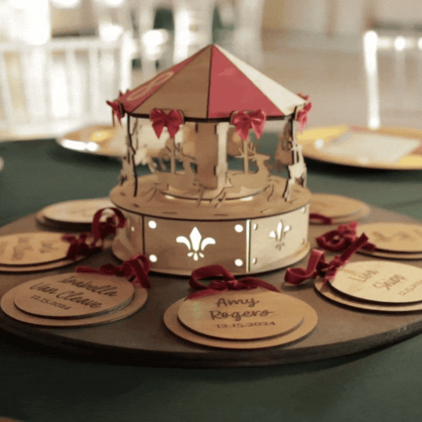 A GIF of a wedding centerpiece carousel spinning slowly