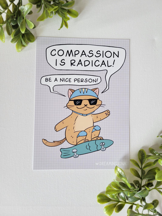 Art print with a cat illustration and text 'Compassion is Radical! Be a nice person!' on a light background.